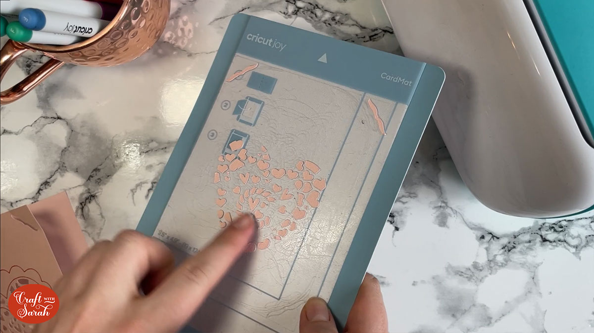 Clear debris from the card mat