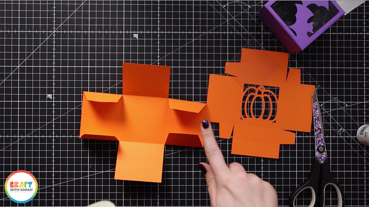 Turn the base shape upside down and then fold all the score lines