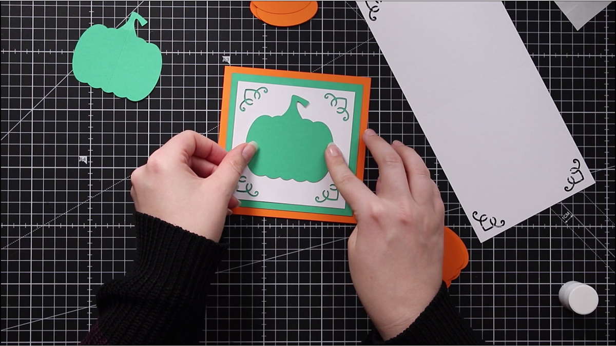 Glue the green pumpkin WITHOUT a score line to the front of your card