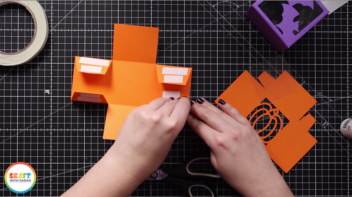 Add double sided tape to the tabs